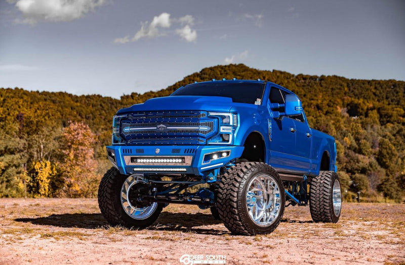 Blue Ford with painted headlights