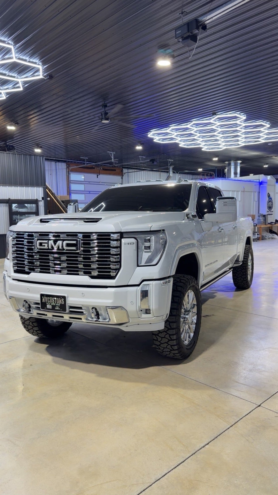 White GMC Sierra HD in the MWCustoms shop